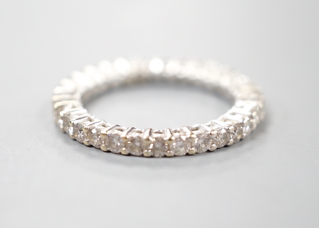 A modern 18ct white gold and diamond set full eternity ring, size M, gross weight 3.4 grams.